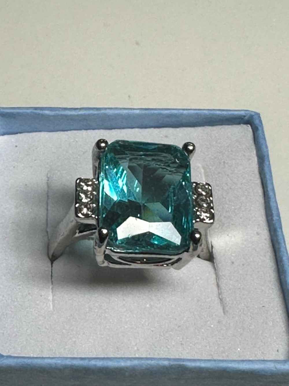 Silver Ring with Teal Emerald-Cut Stone and Accent Crystals